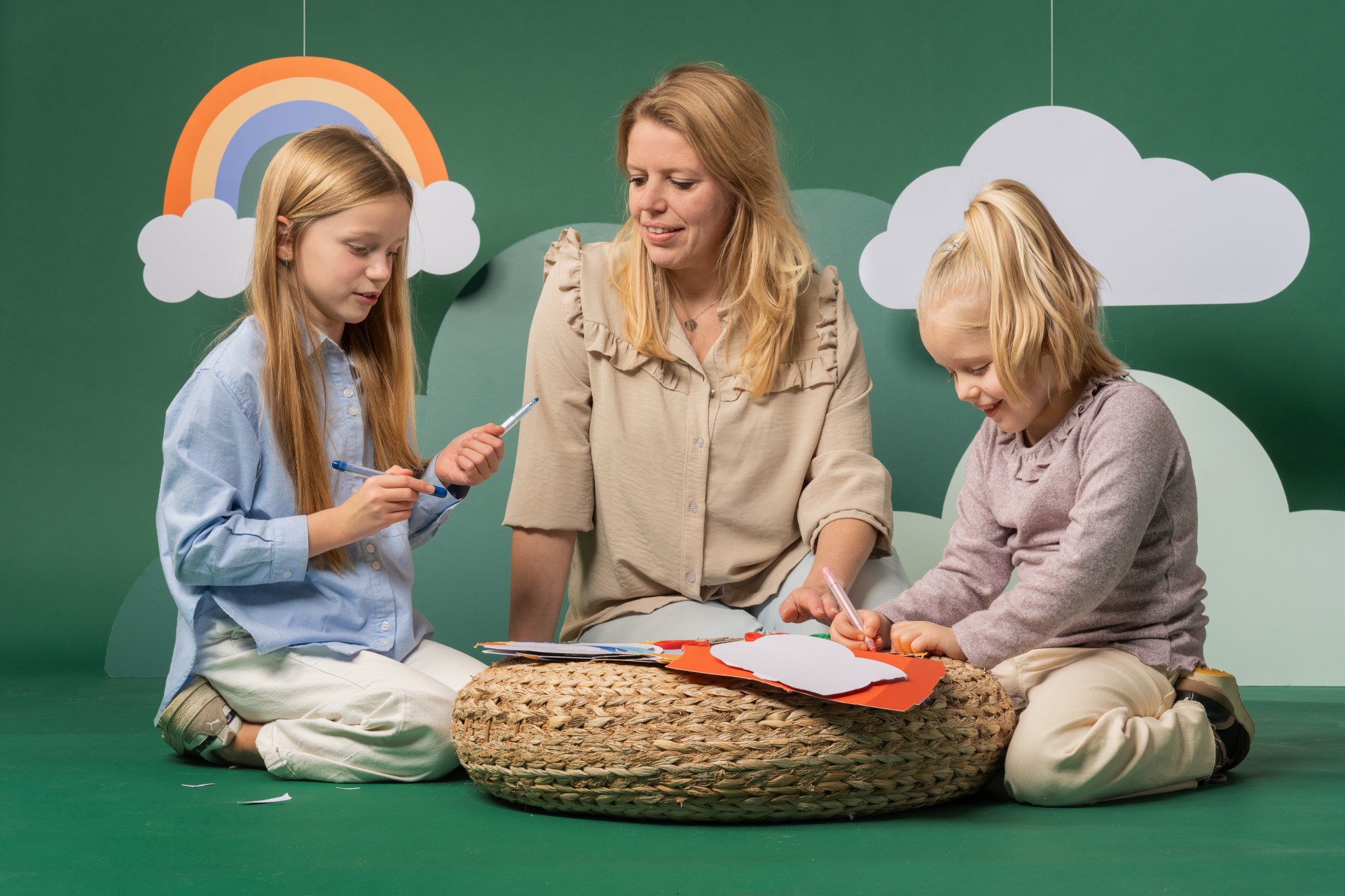 Two women playing with several children