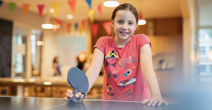 Child Plays Table Tennis at Basker International Childcare