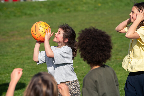 Girl throws basketball