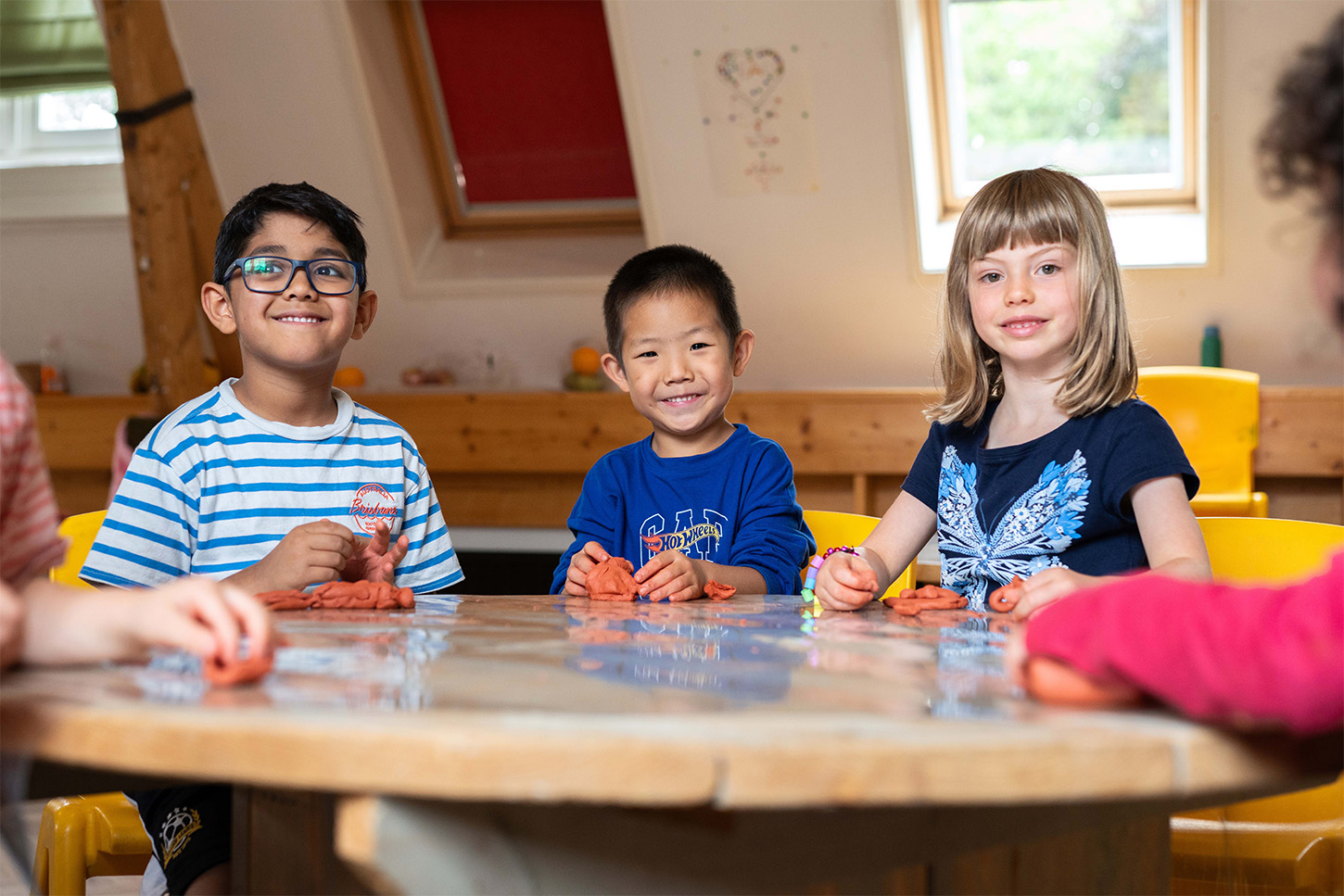 Children playing with clay at Basker International Daycare
