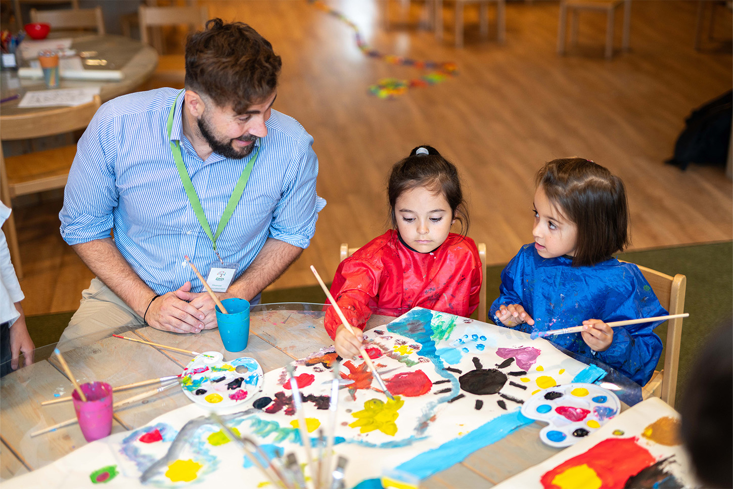 Children painting at Basker Childcare International