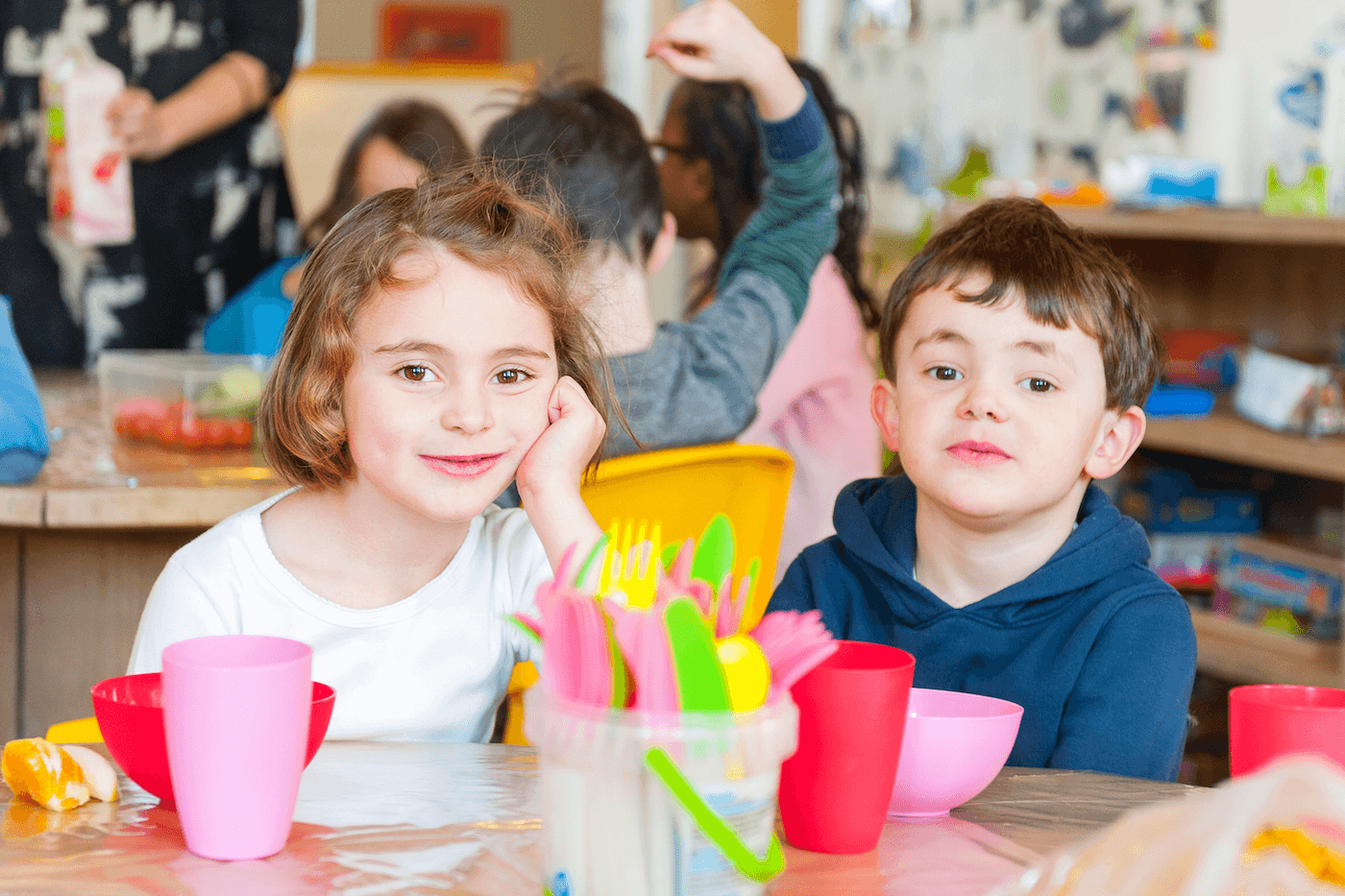 Boy and girl at After School Care ready to have lunch
