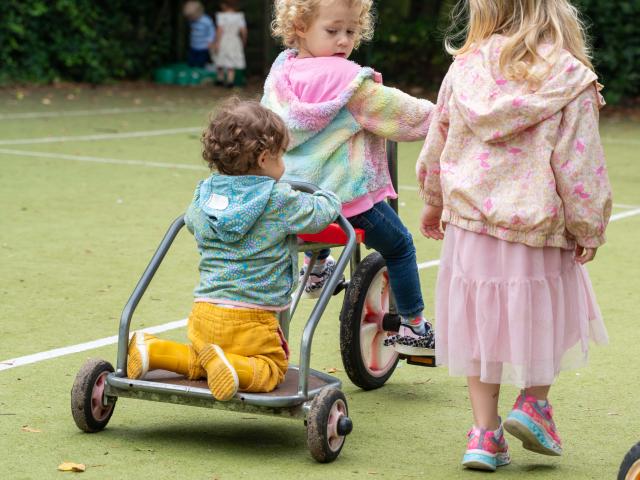 Child on a Bike with a baby behind