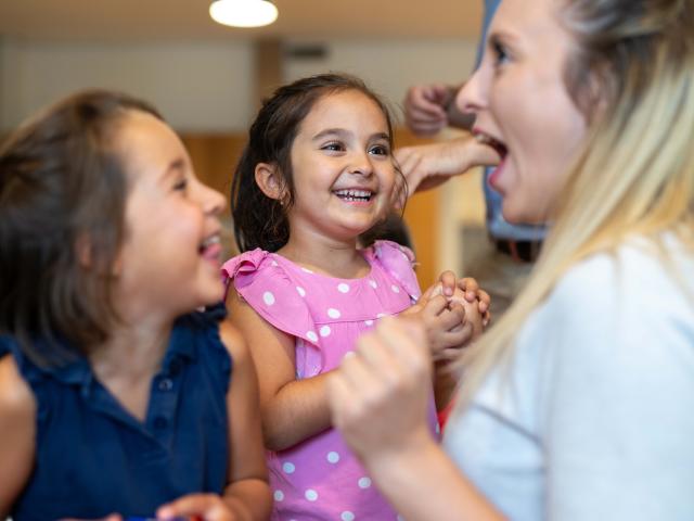 Girls and teacher having fun at Basker International Childcare