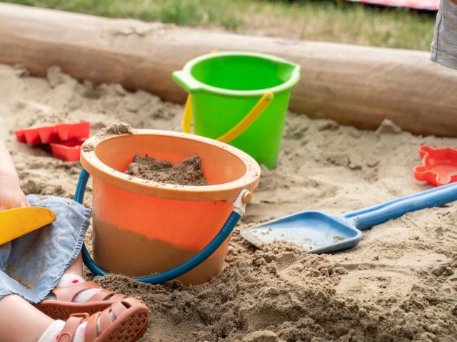 Sand pit with tools for playing with sand