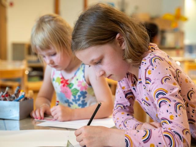 Girls drawing at Basker International Childcare