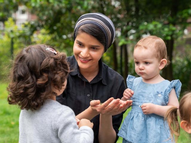 Teacher talking with children