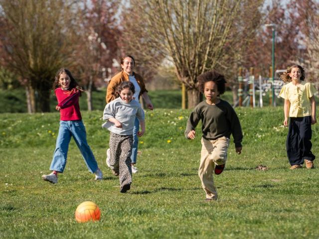 Children playing soccer at Basker International Childcare
