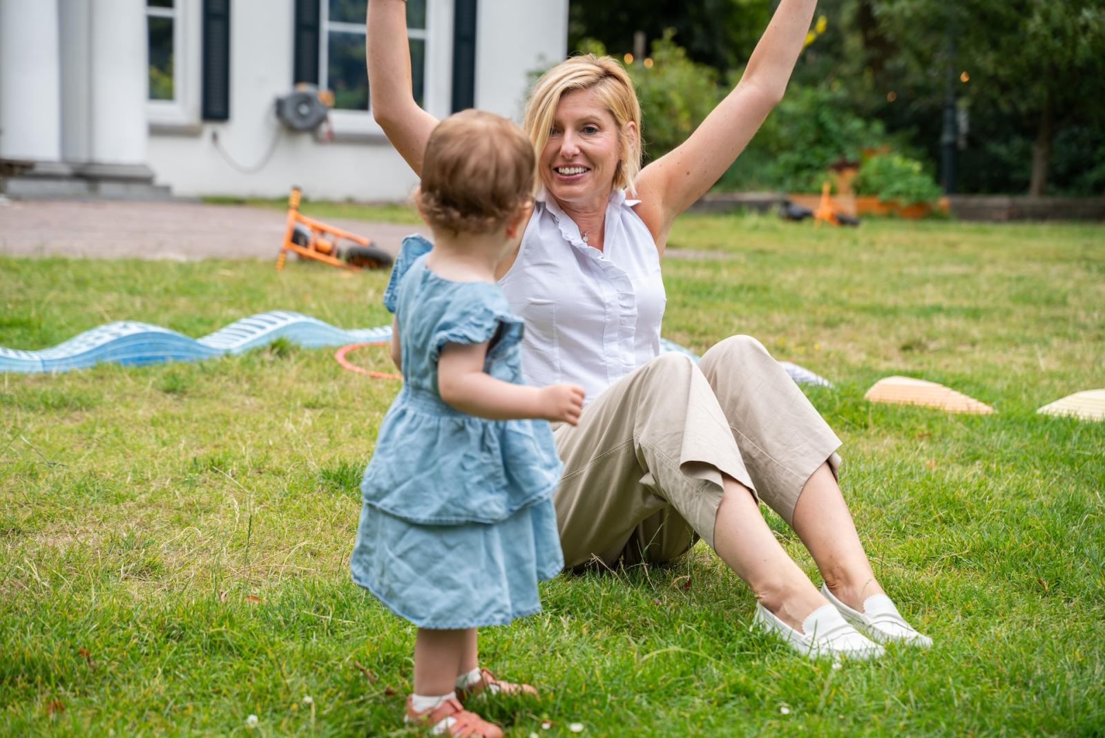 Basker International Childcare teacher cheers for little girl