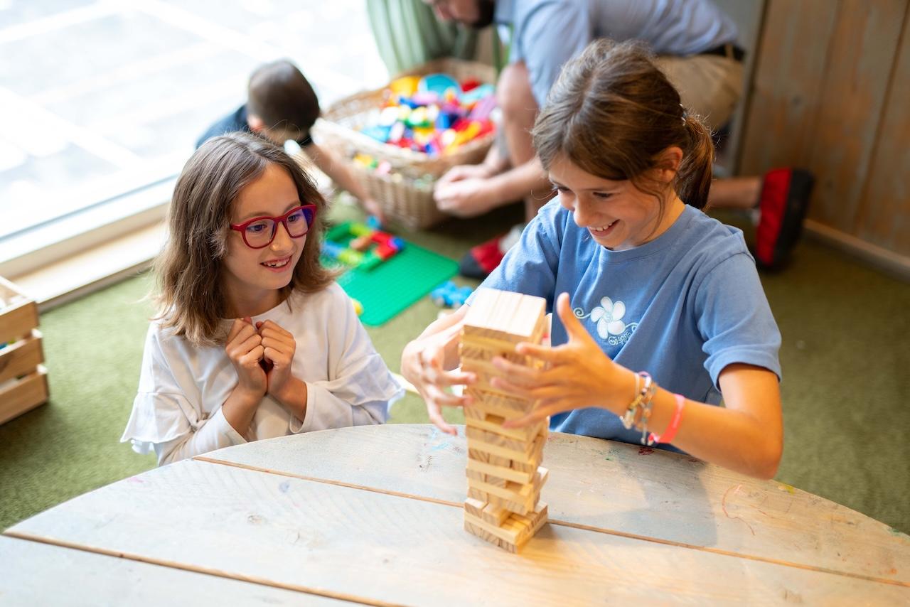 Girls playing Jenga at After School Care