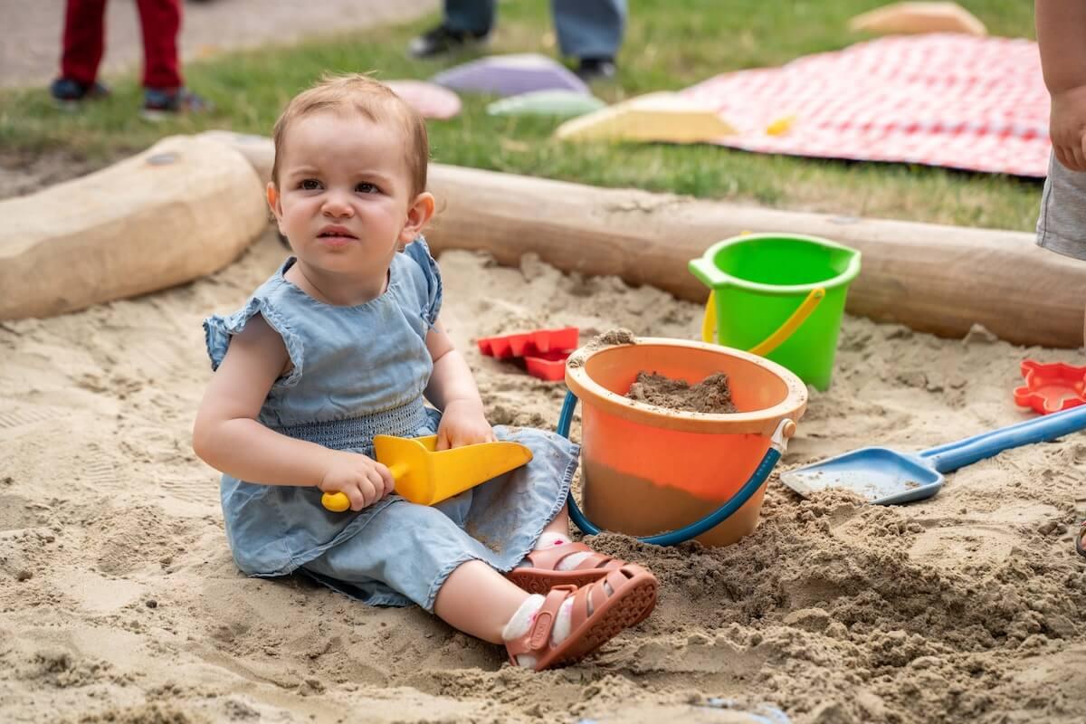 Girl playing with sand