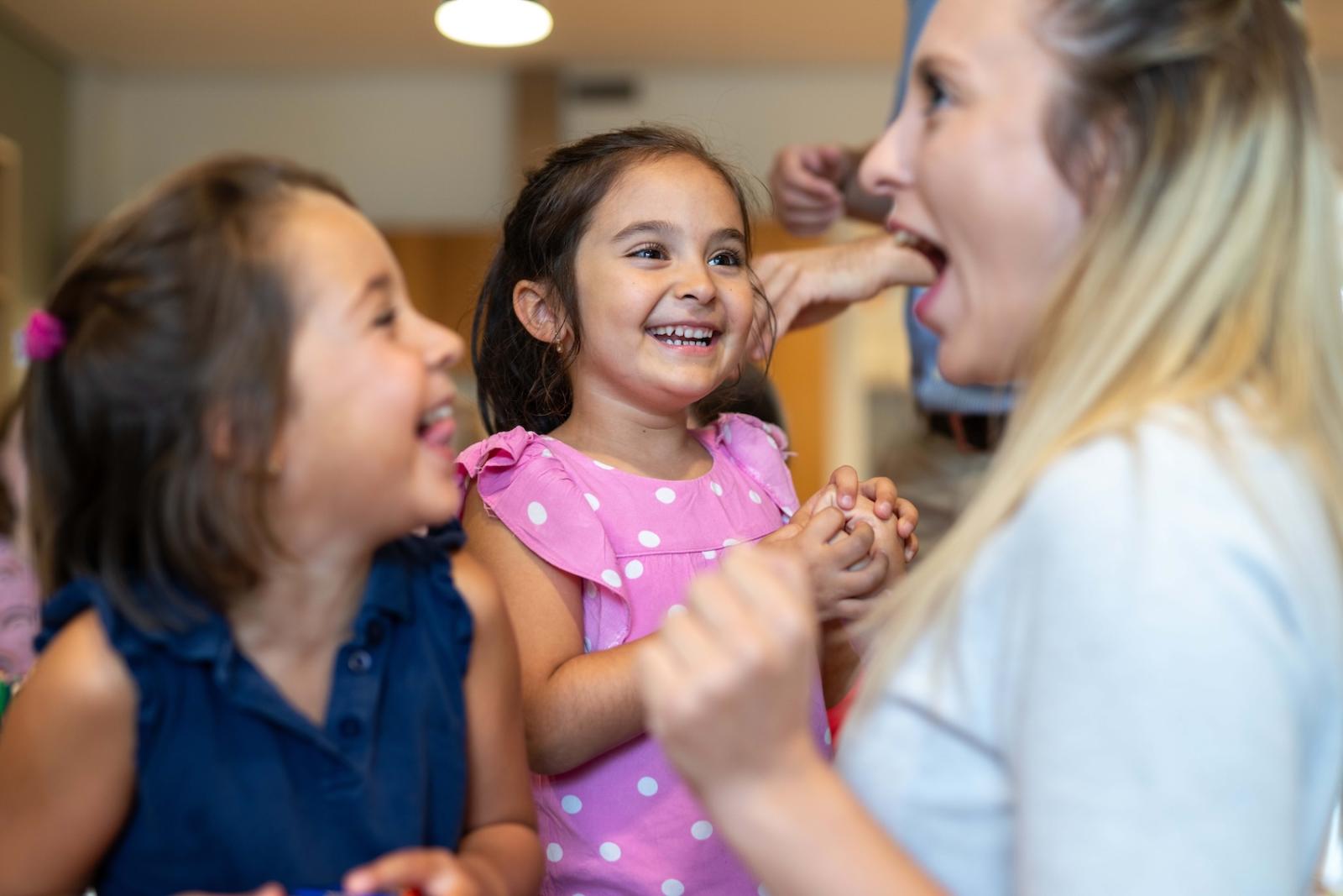 Girls and teacher having fun at Basker International Childcare