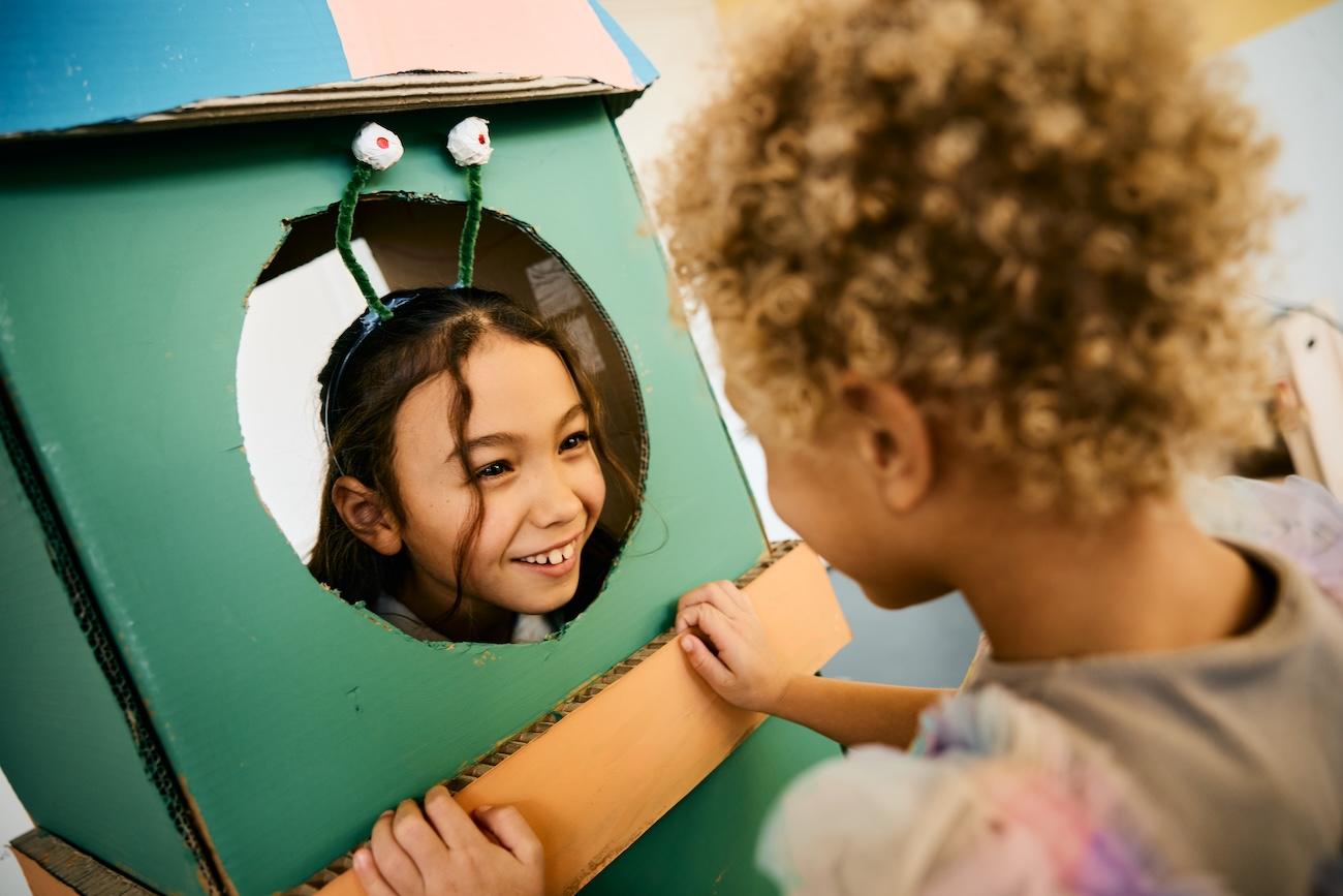 Girls playing with a space ship at Basker International Childcare