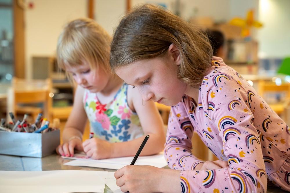 Girls drawing at Basker International Childcare