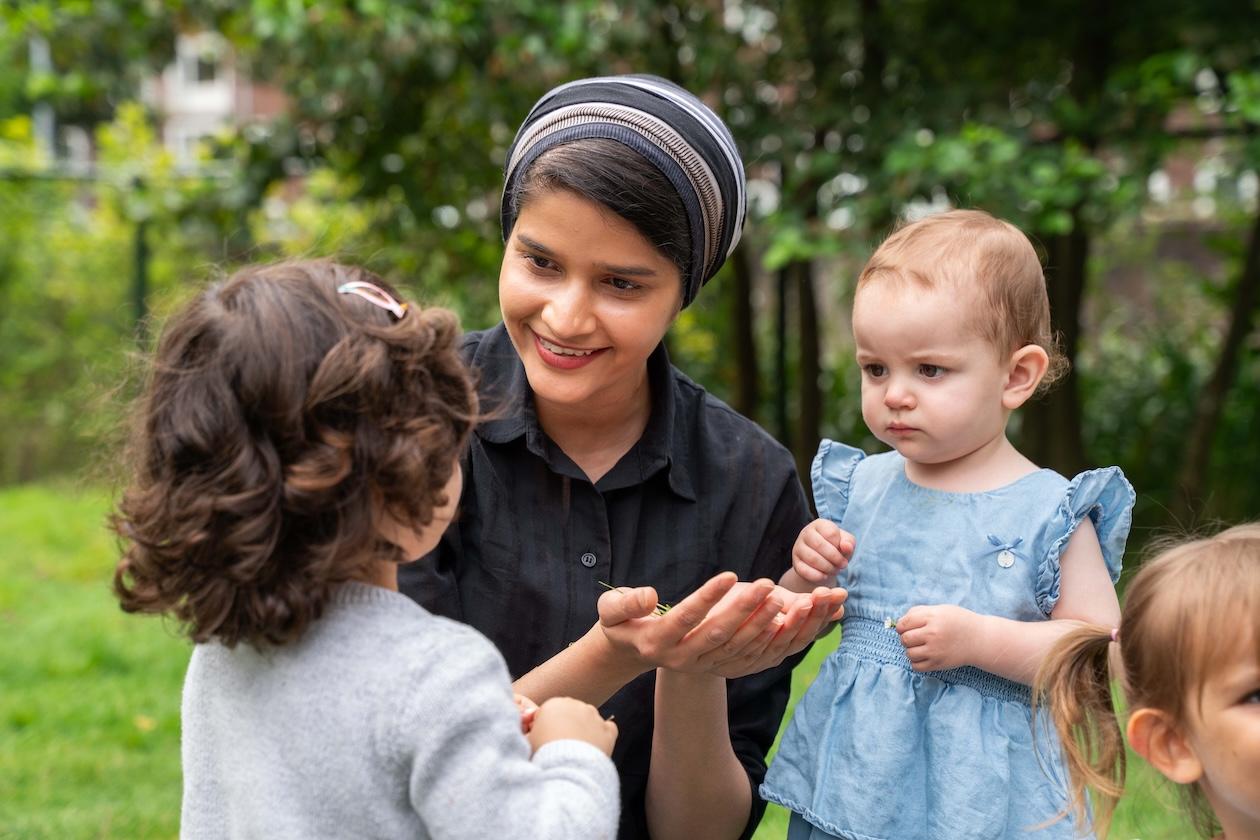 Teacher talking with children