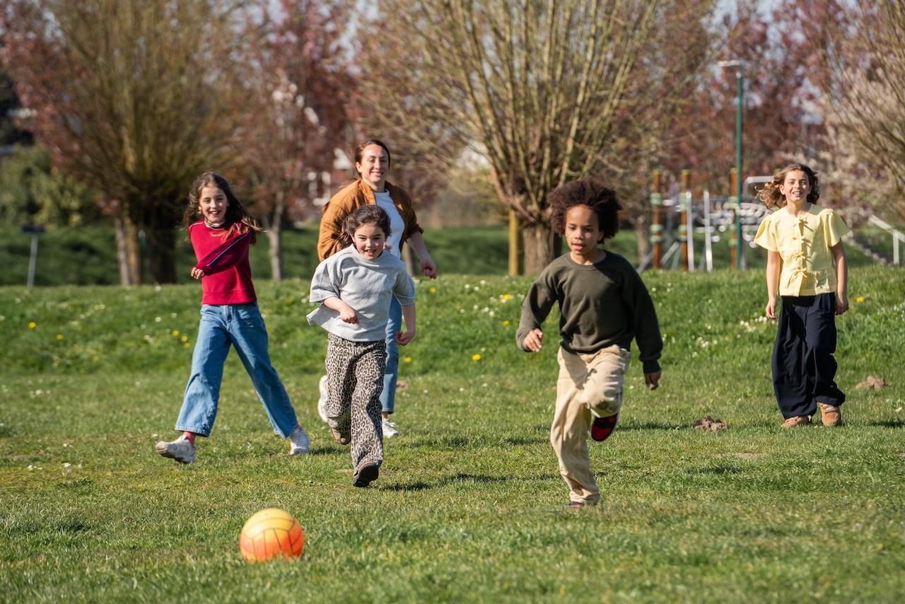 Children playing soccer at Basker International Childcare